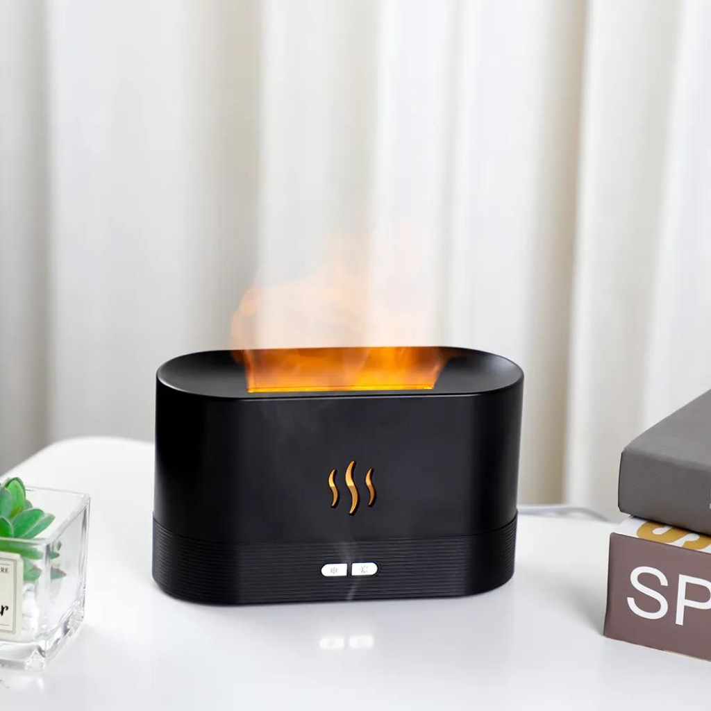 Black aroma diffuser with orange smoke