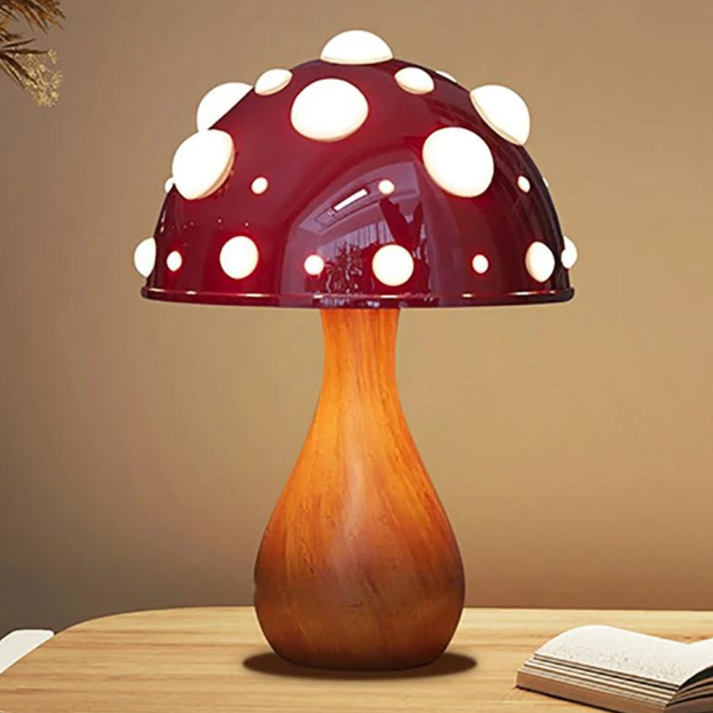 Red capped mushroom lamp on a desk on a table