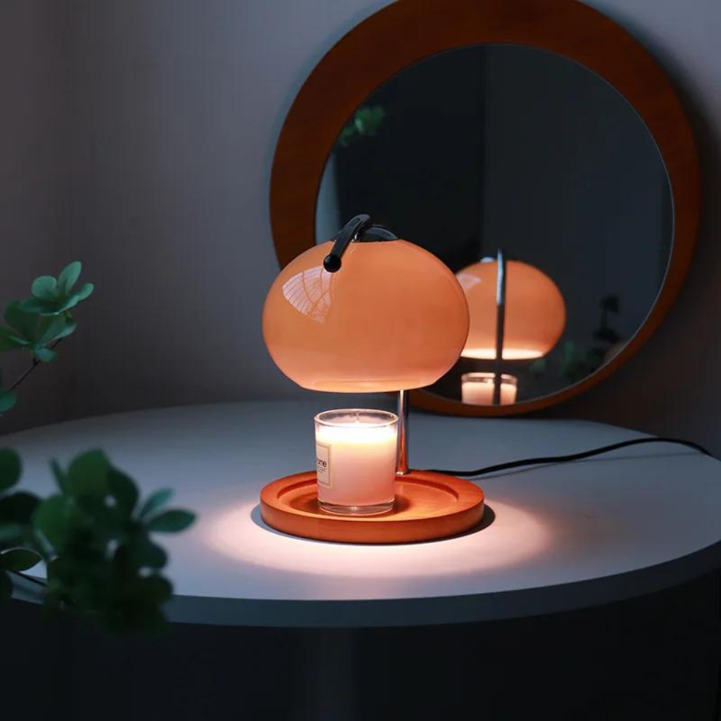 Retro Glass Candle Warmer on a desk with a mirror and the lights off