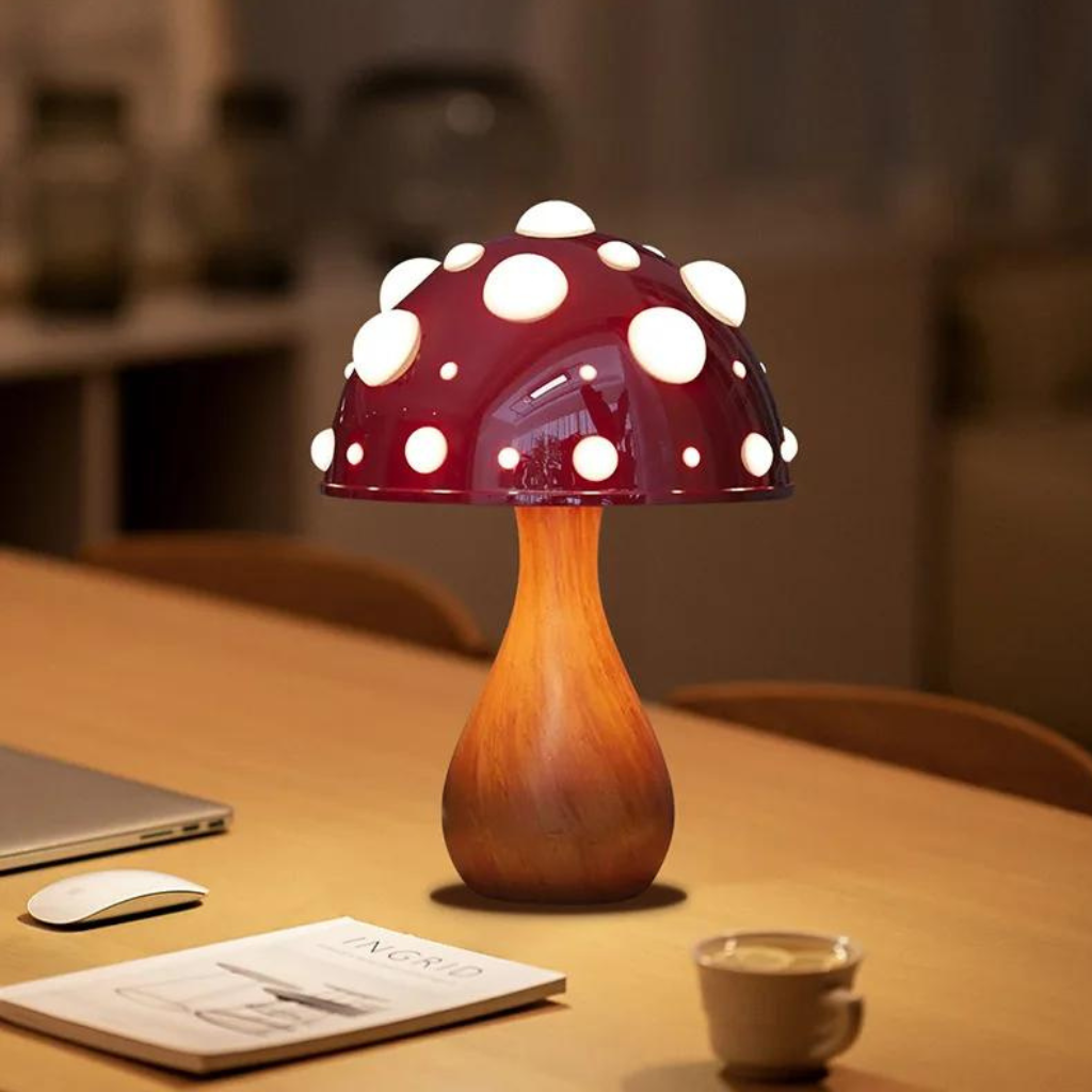 Red capped mushroom lamp on a desk