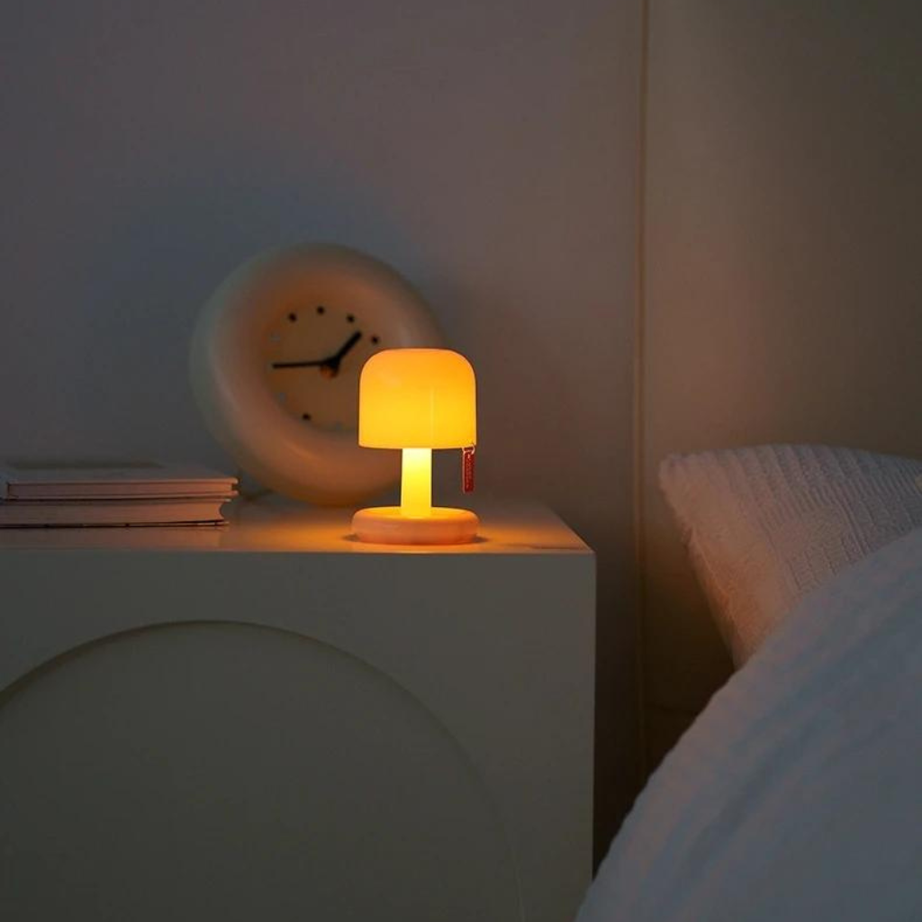 Mini desk lamp on a bed side table