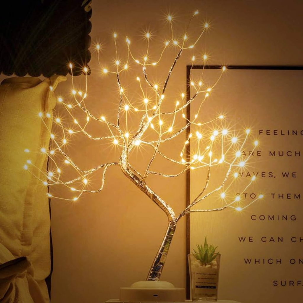 Twinkling fairy light lamp on bedside table