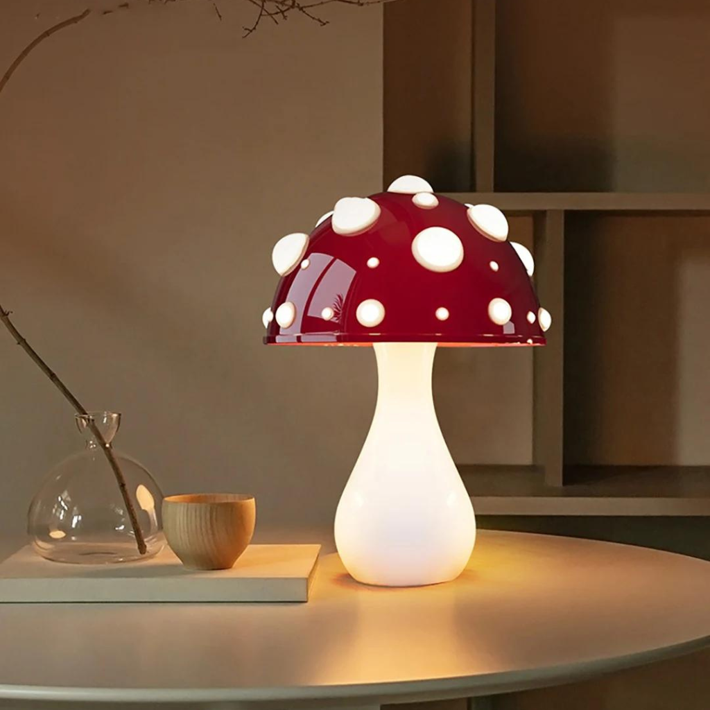 Red capped mushroom lamp on a desk